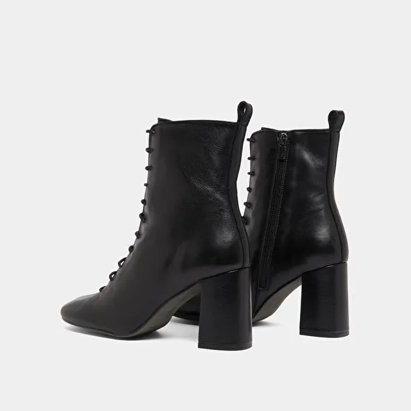 Heeled and lace-up ankle boots in black leather